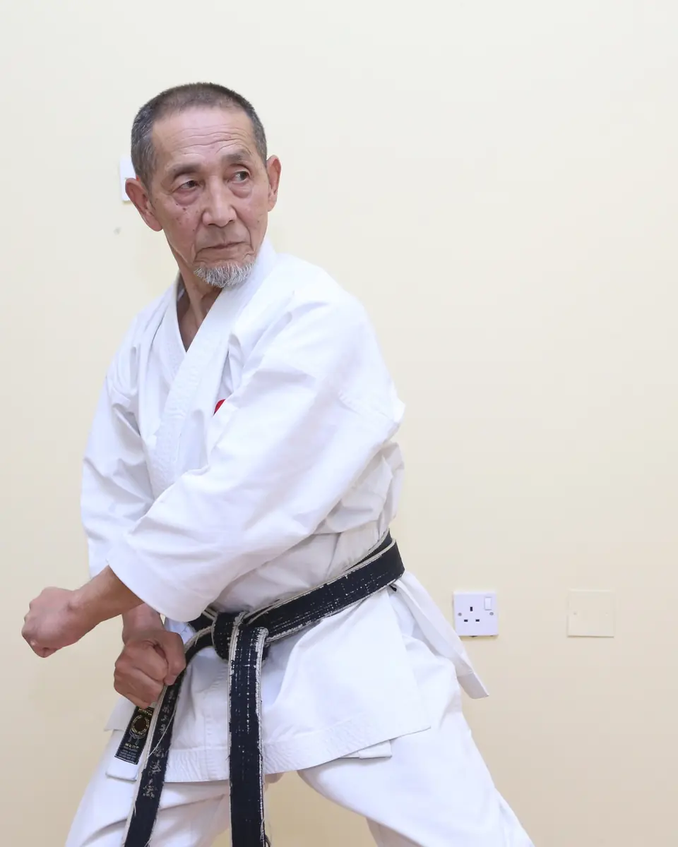 Senior instructor in a low karate stance